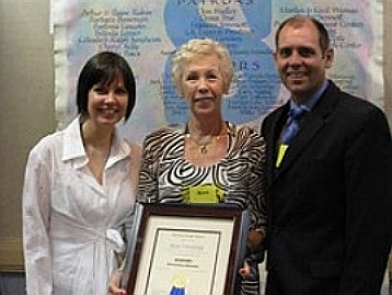 Rose receiving the award